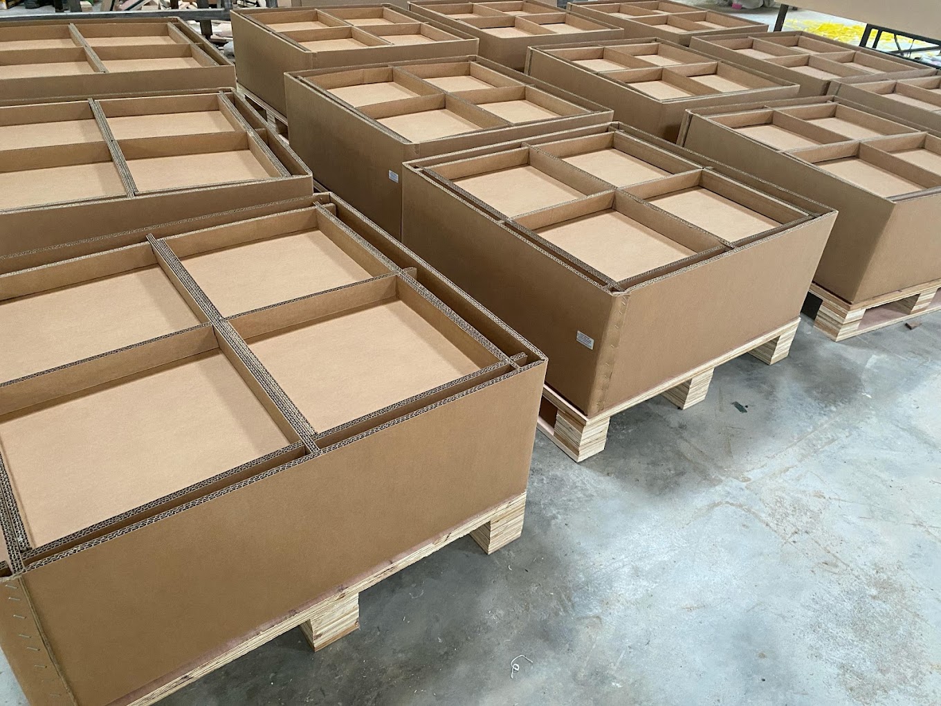 Corrugated multi-compartment boxes partitioned to hold several parts in one crate