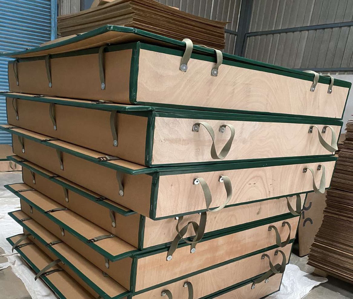 Stacked green-edged plywood carry cases